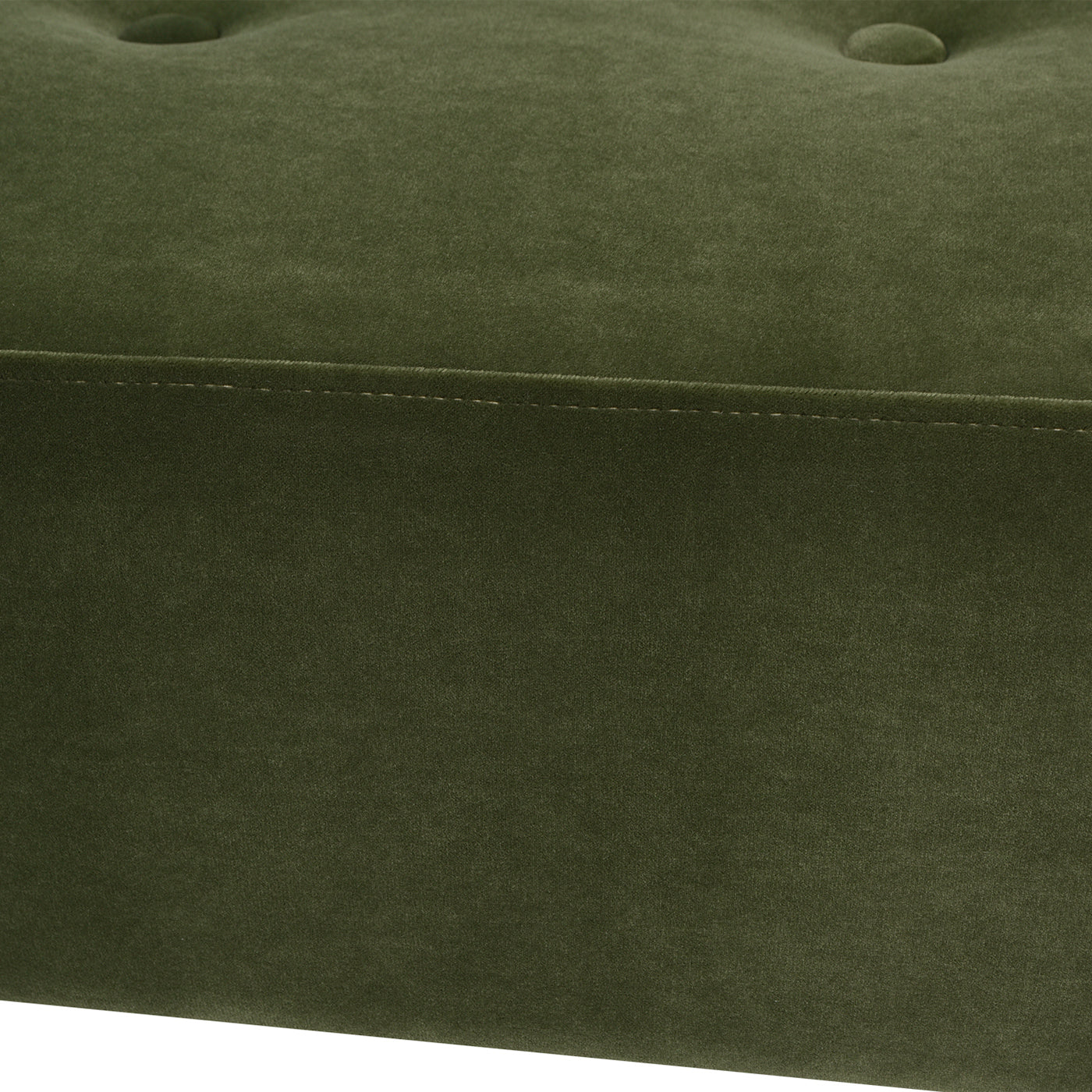 Closeup of dark olive green velvet tufted ottoman with stitched pocket detail