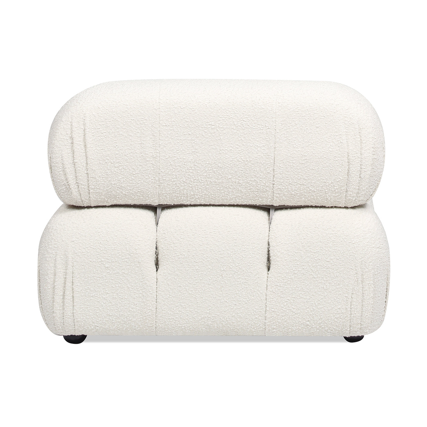 Plush white boucl ottoman with rounded edges and tufted detailing