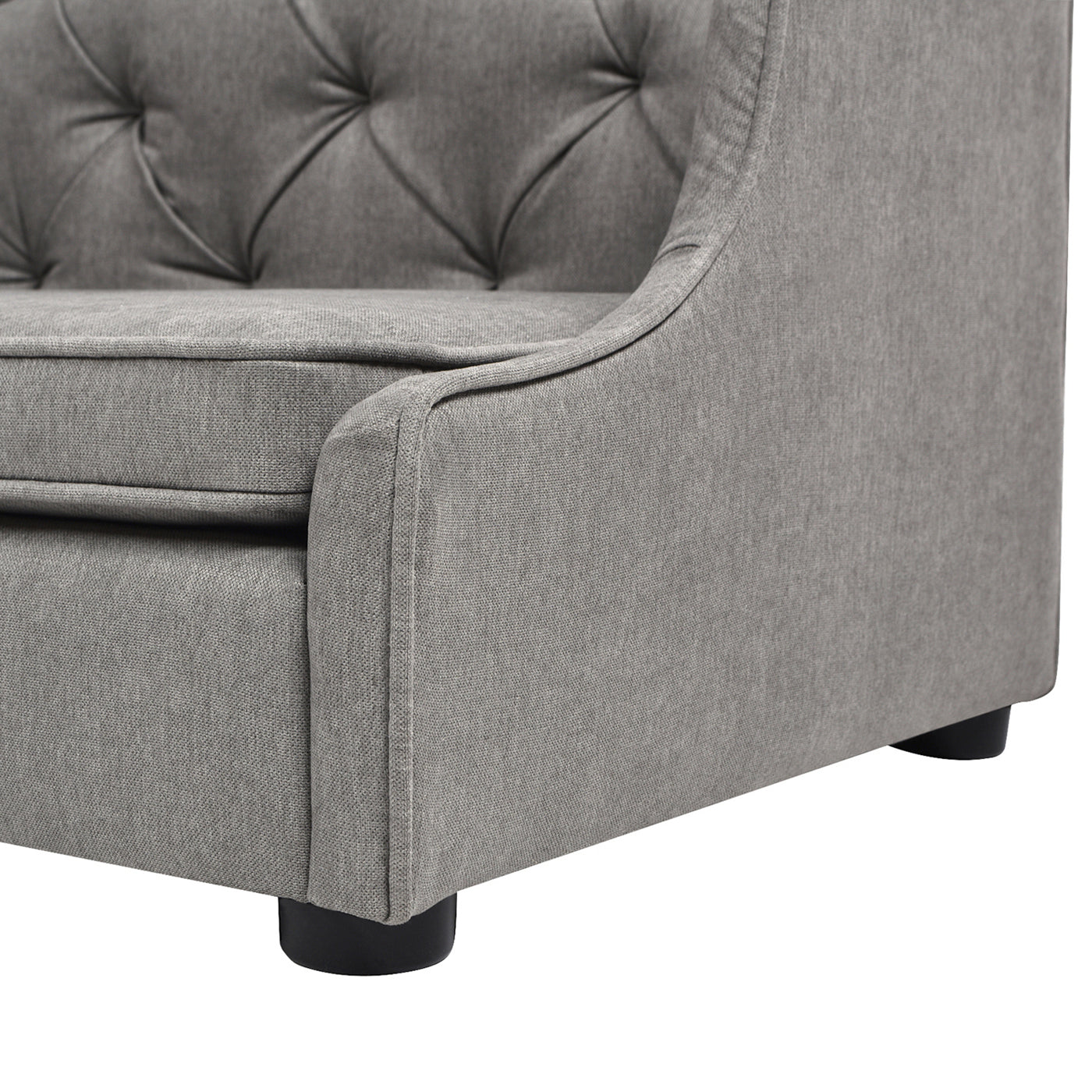 Gray fabric armchair with tufted backrest and padded seat