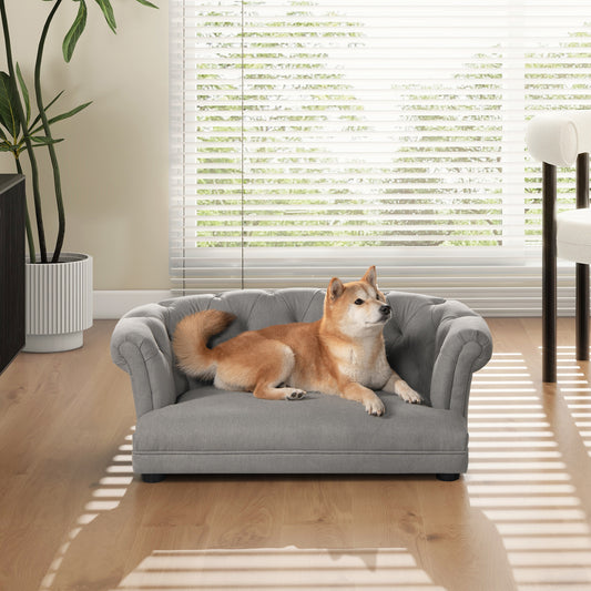 Grey tufted dog sofa with elegant rolled arms for cozy pet relaxation