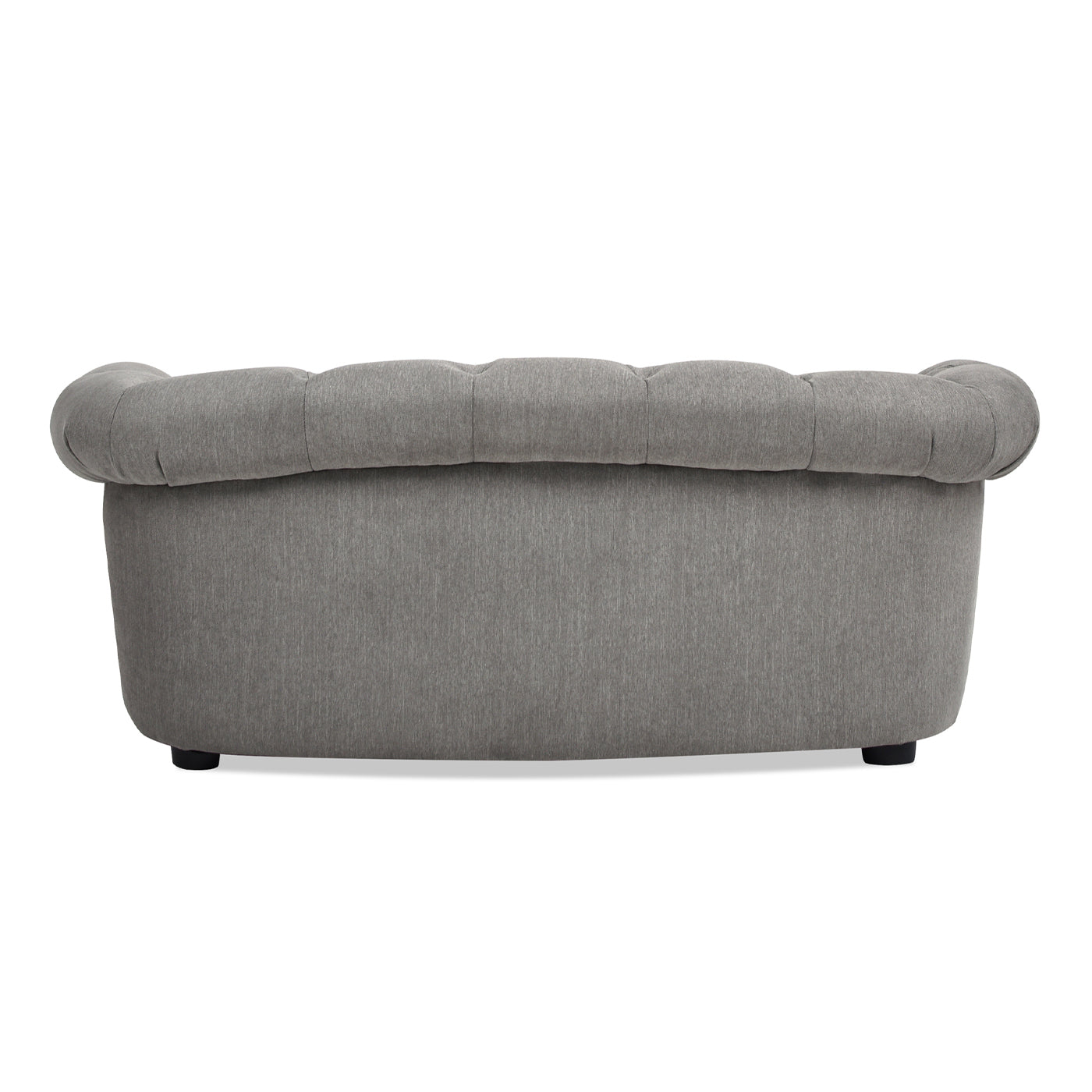 Tufted grey fabric sofa with a curved silhouette and subtle button detailing