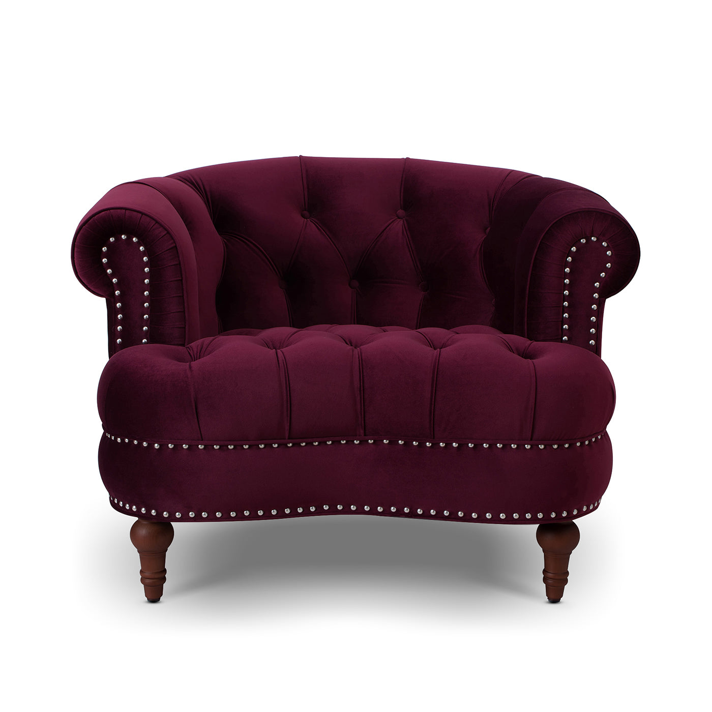 Plush velvet armchair in deep plum featuring tufted back and silver nailhead trim