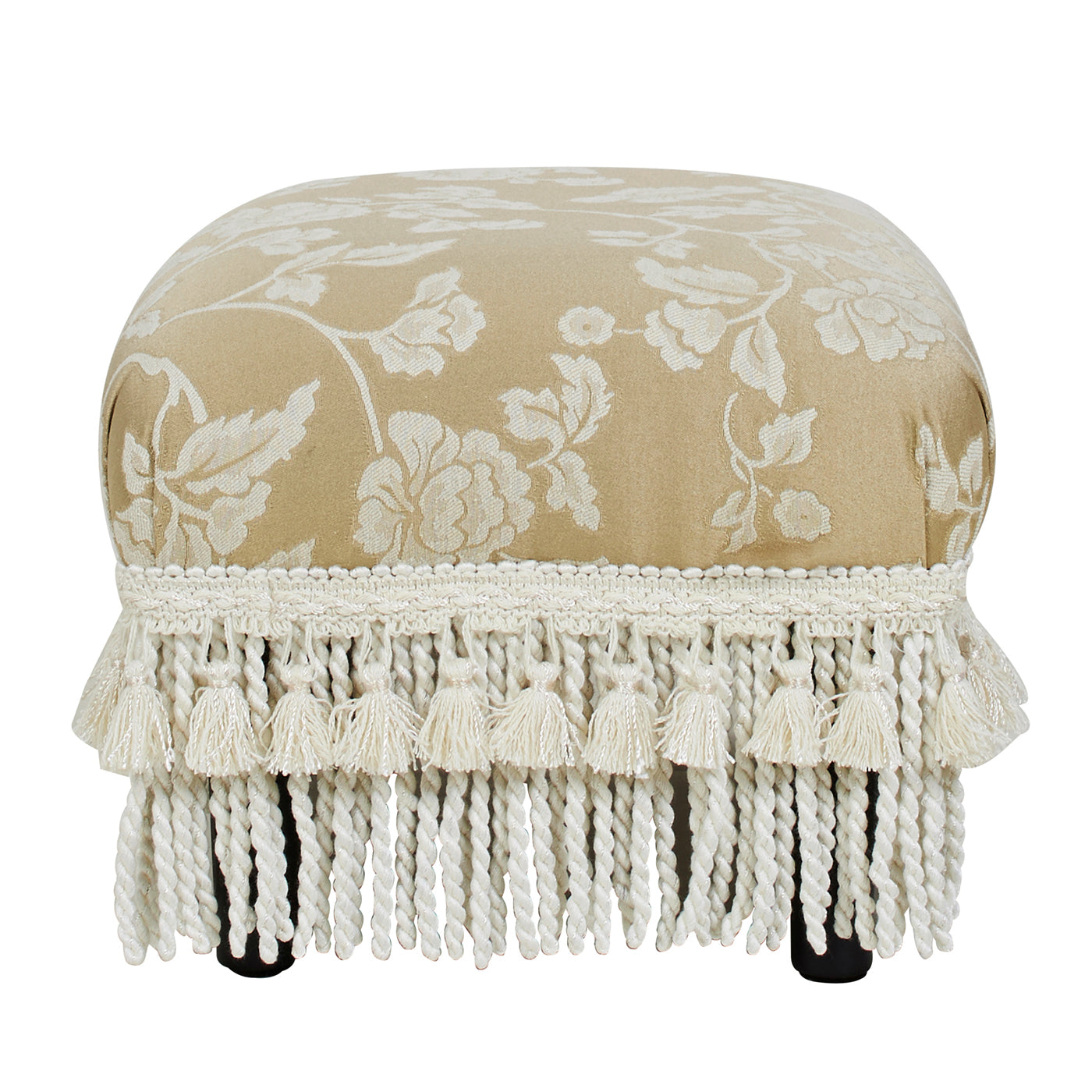 Ornate beige footstool with floral pattern and decorative tassels