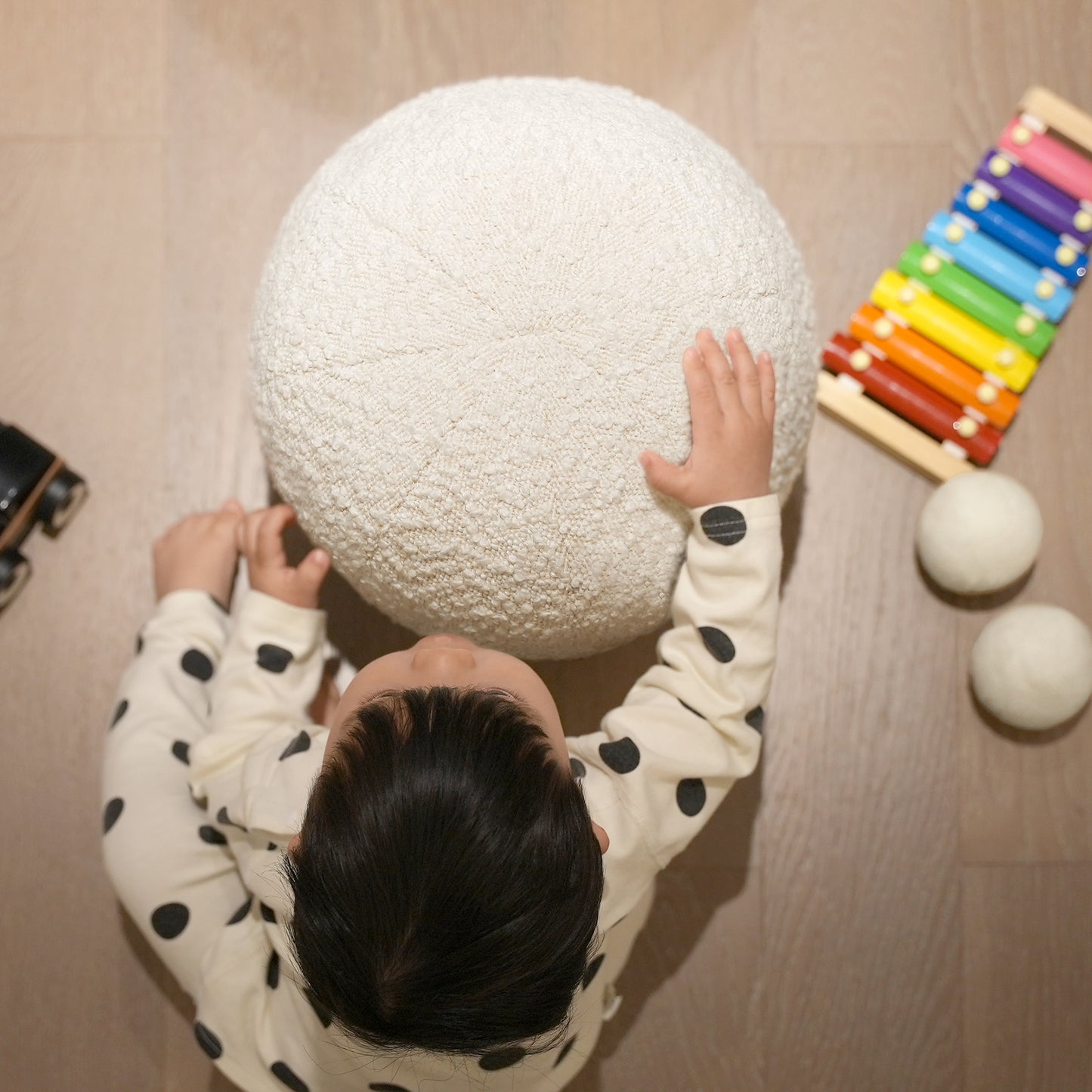 White textured round pouf for childrens playroom