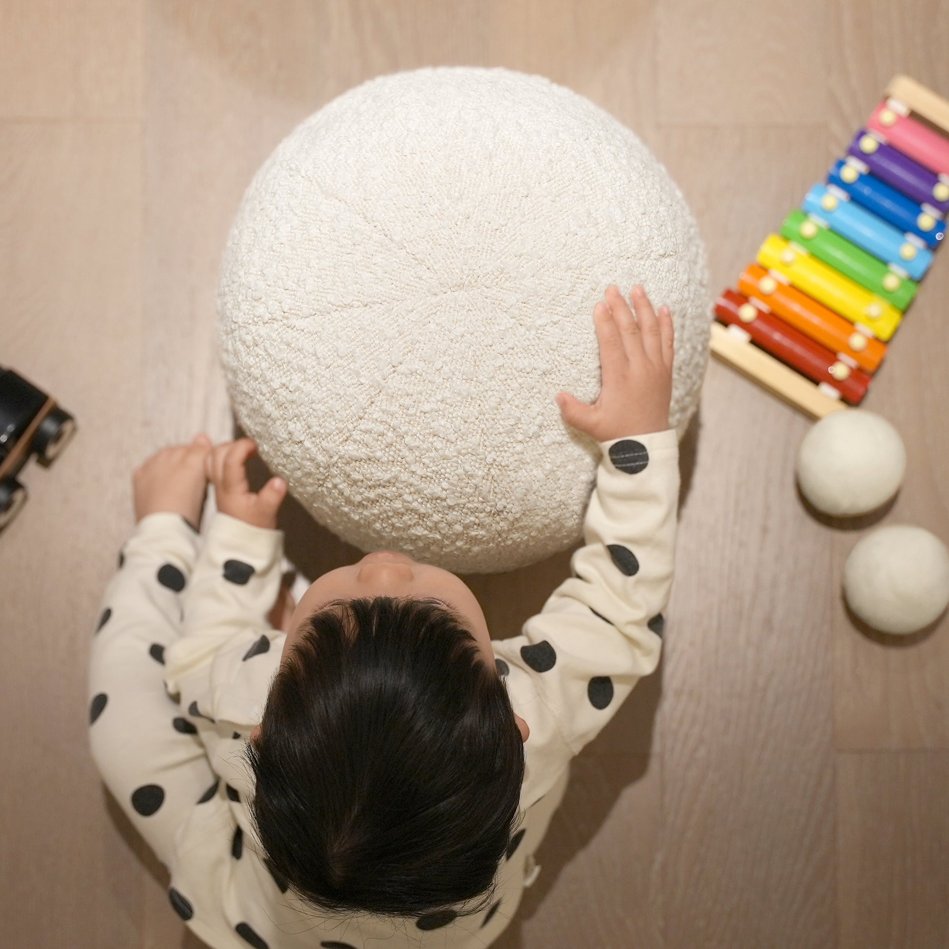 White textured round pouf for childrens playroom