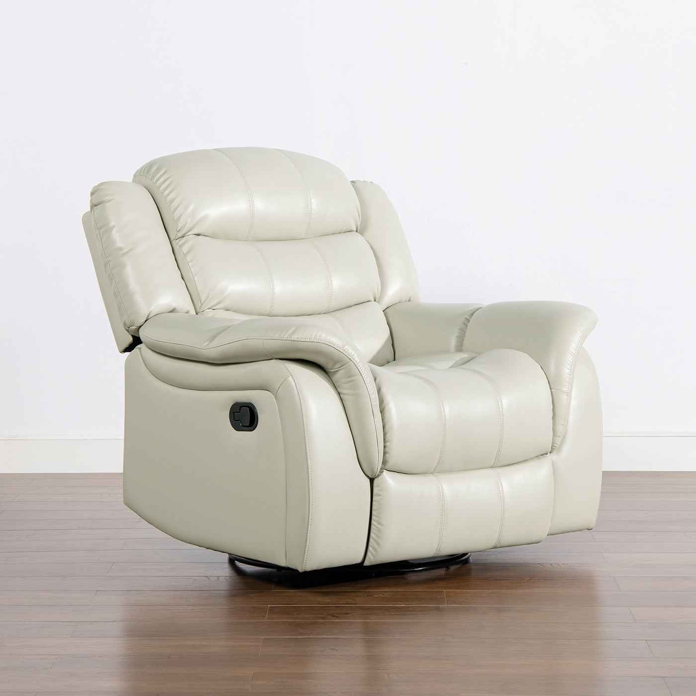 Cream leather recliner chair with plush padding and black lever control on a wooden floor