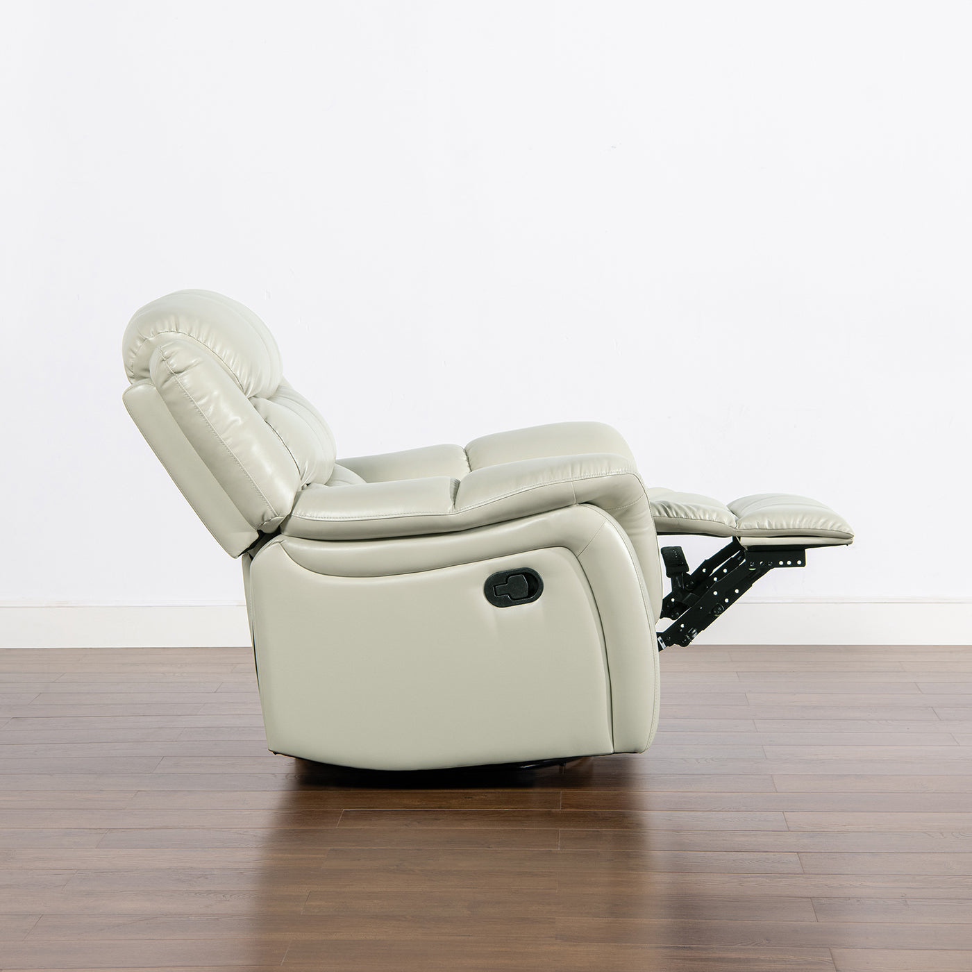 Light gray leather recliner chair with extended footrest and reclining mechanism