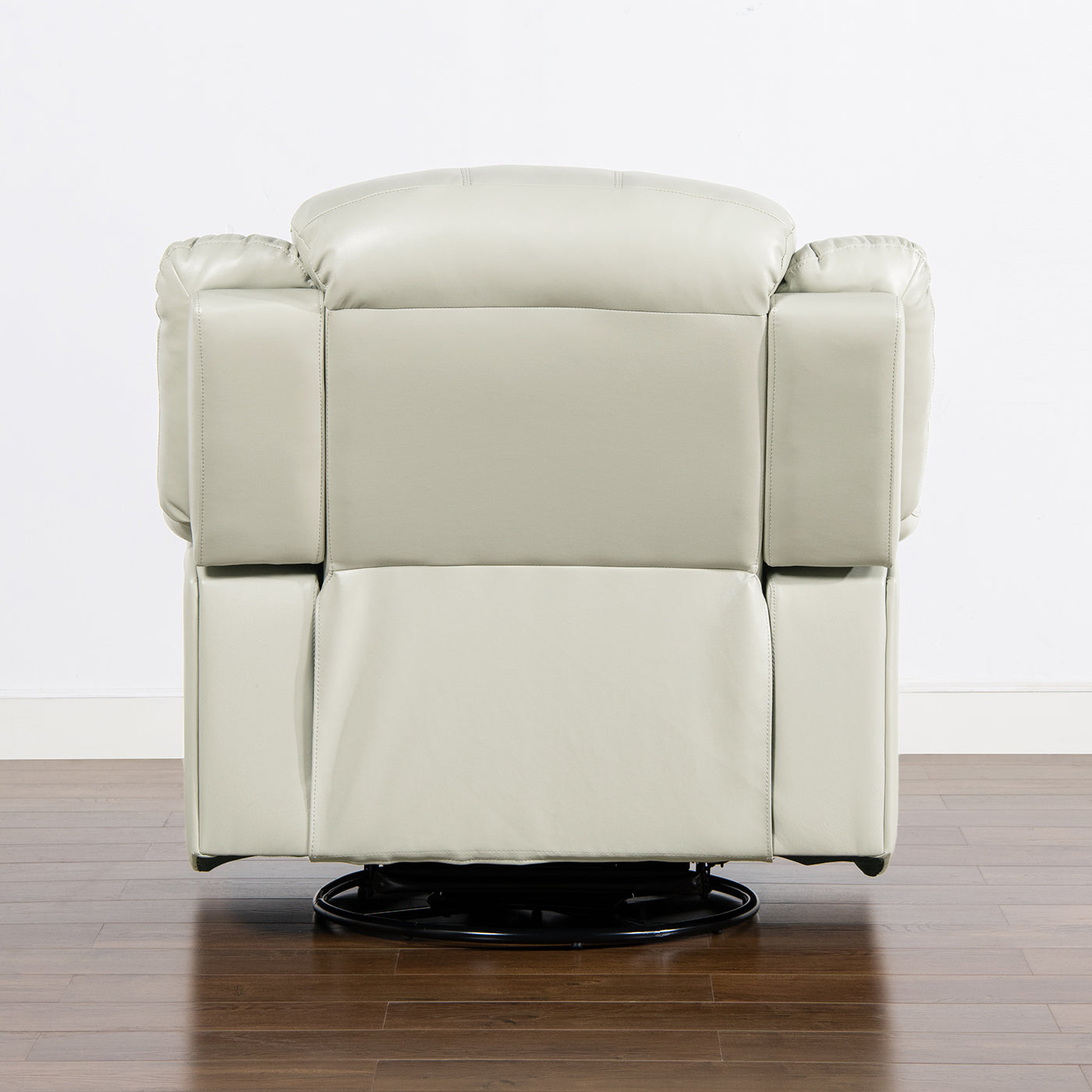 Back view of a plush light grey leather recliner chair with padded arms and a swivel base