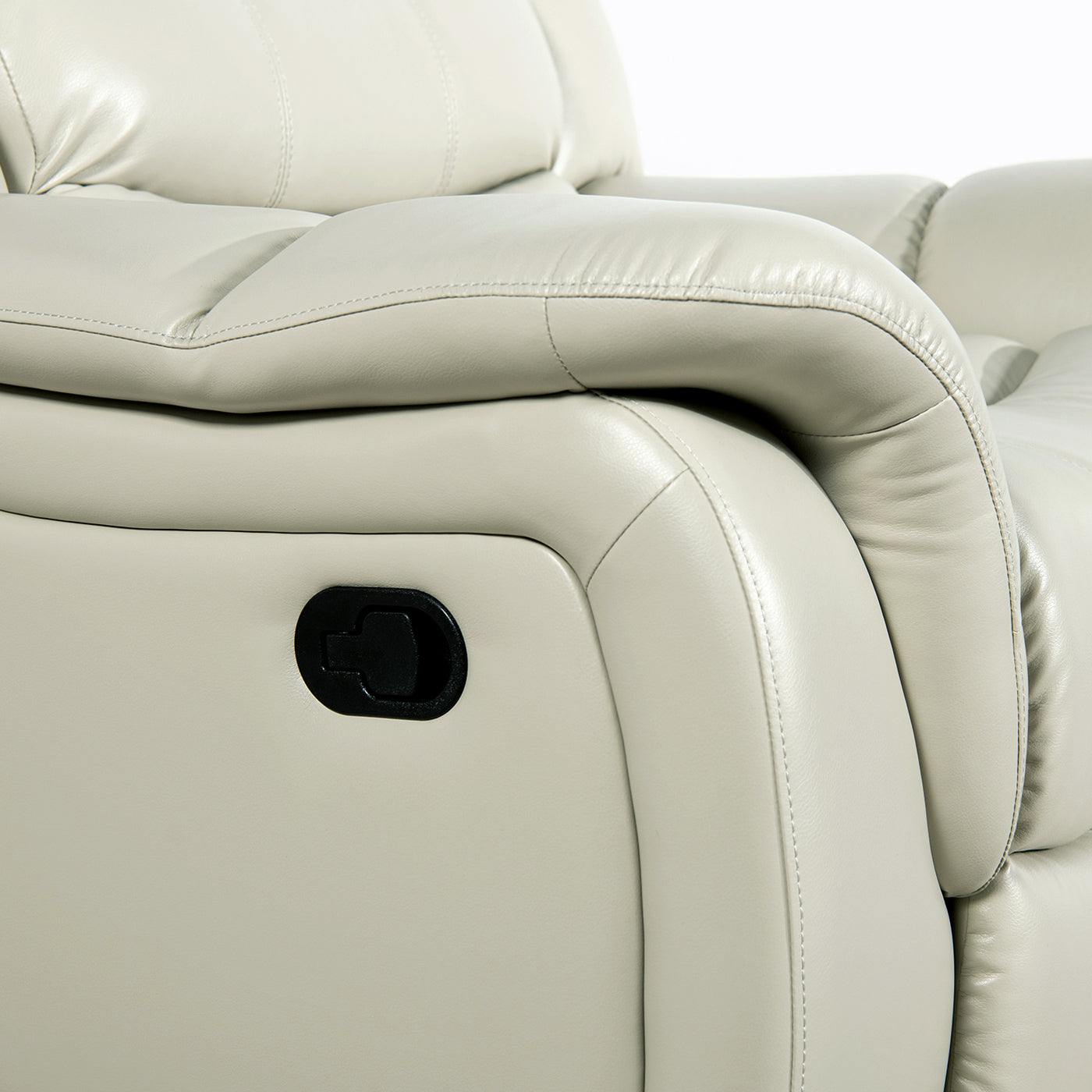 Closeup of a cream leather recliner armrest with a black lever mechanism for comfort