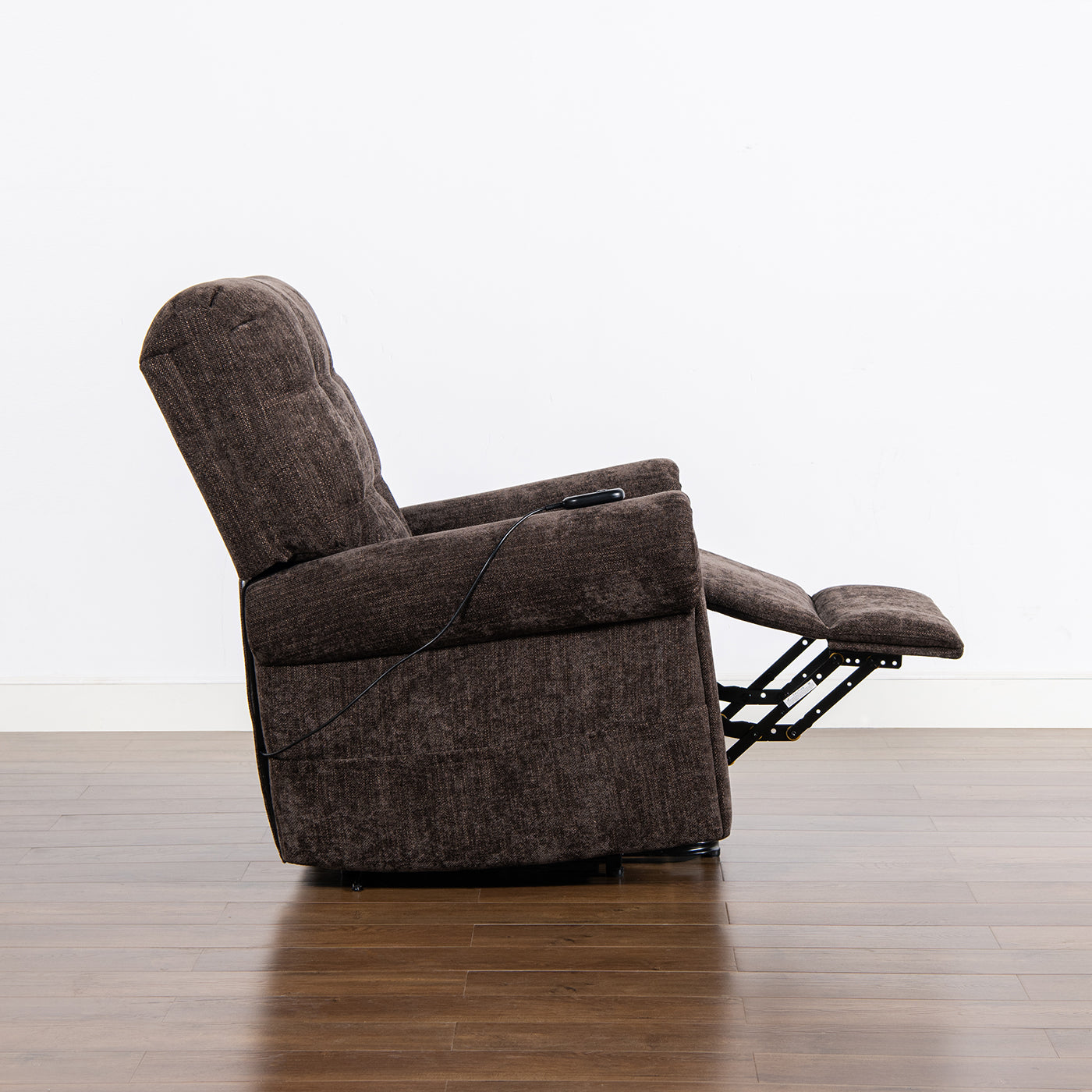 Brown fabric power recliner chair with extended footrest and tilted back