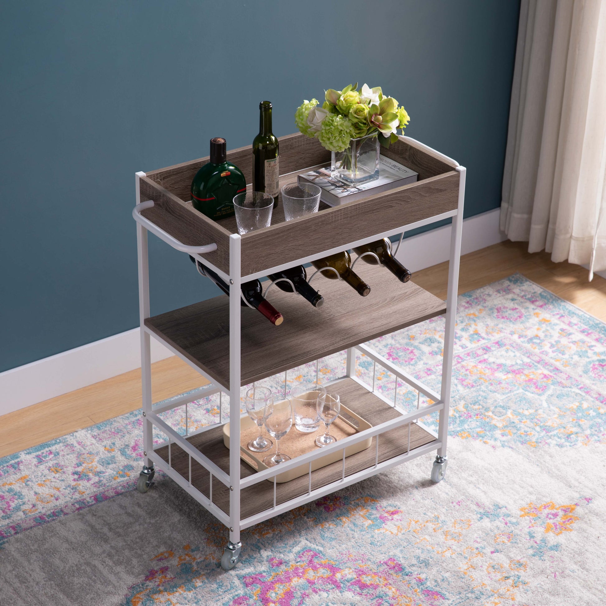 Compact rolling bar cart with wood finish shelves and white frame