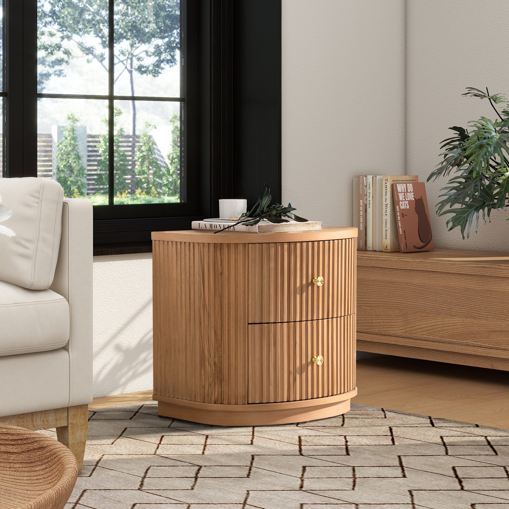 Light oak ribbed nightstand with two brass knob drawers beside a cream sofa and window