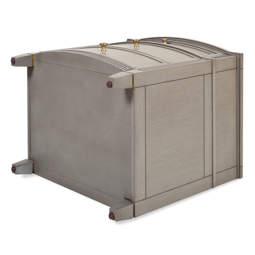 Grey wooden accent chest with decorative brass knobs and curved lid detail