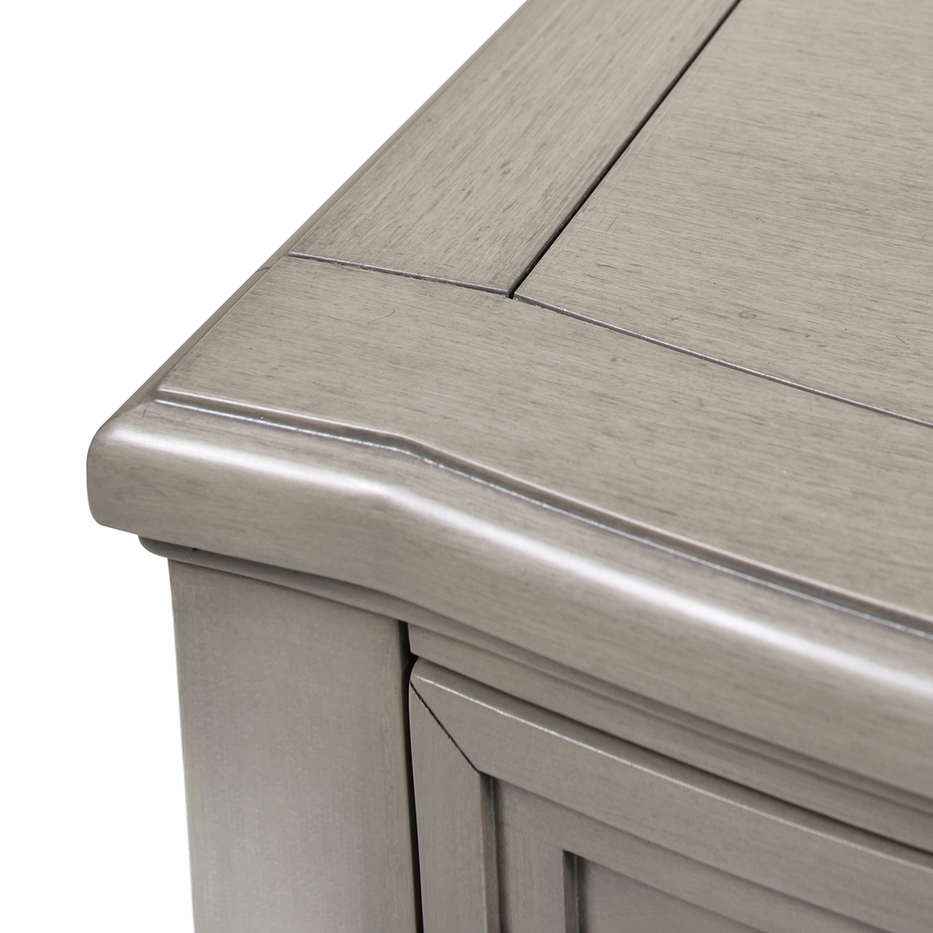 Closeup of distressed grey wood furniture top with clean lines