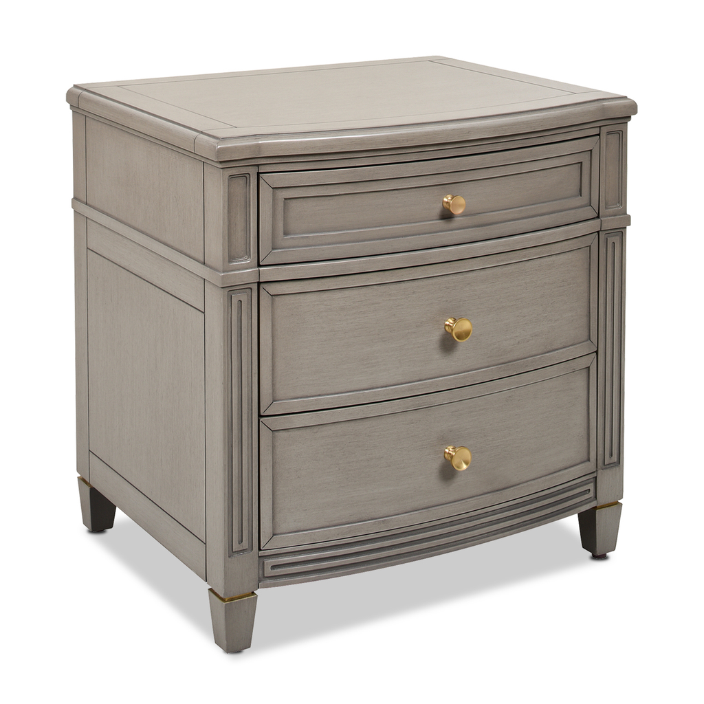 Gray threedrawer bedside table with brass knobs and gold accents