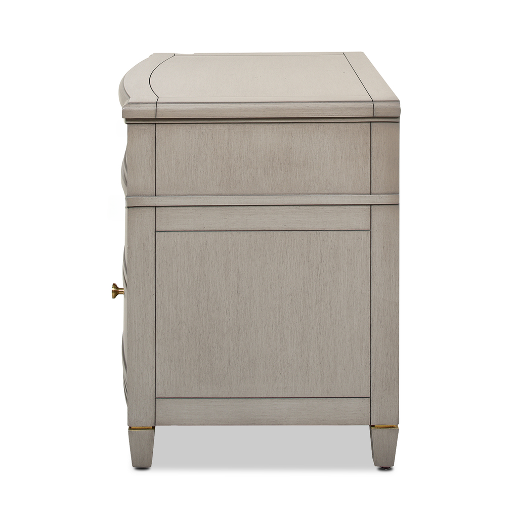 Light gray wooden nightstand with ornate detailing and brass hardware