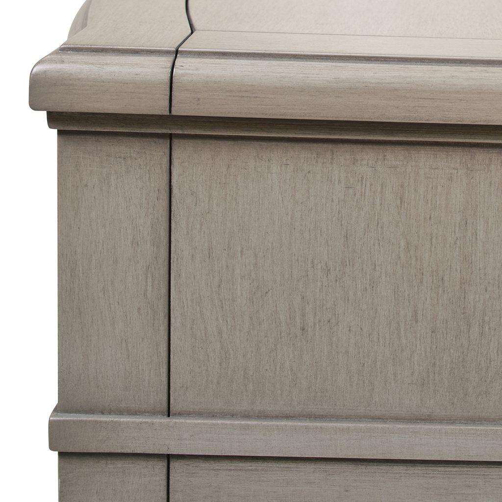 Gray wood dresser detail showing textured finish and clean lines for modern storage