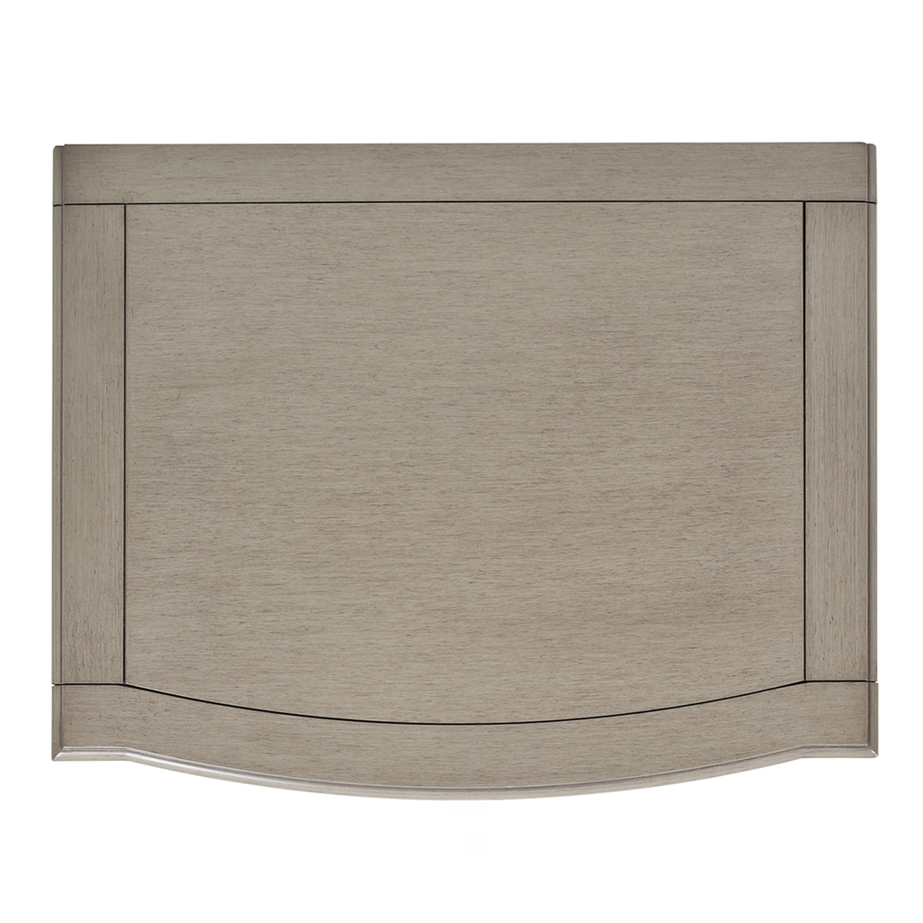 Gray wood veneer top surface of a dresser drawer with curved bottom edge