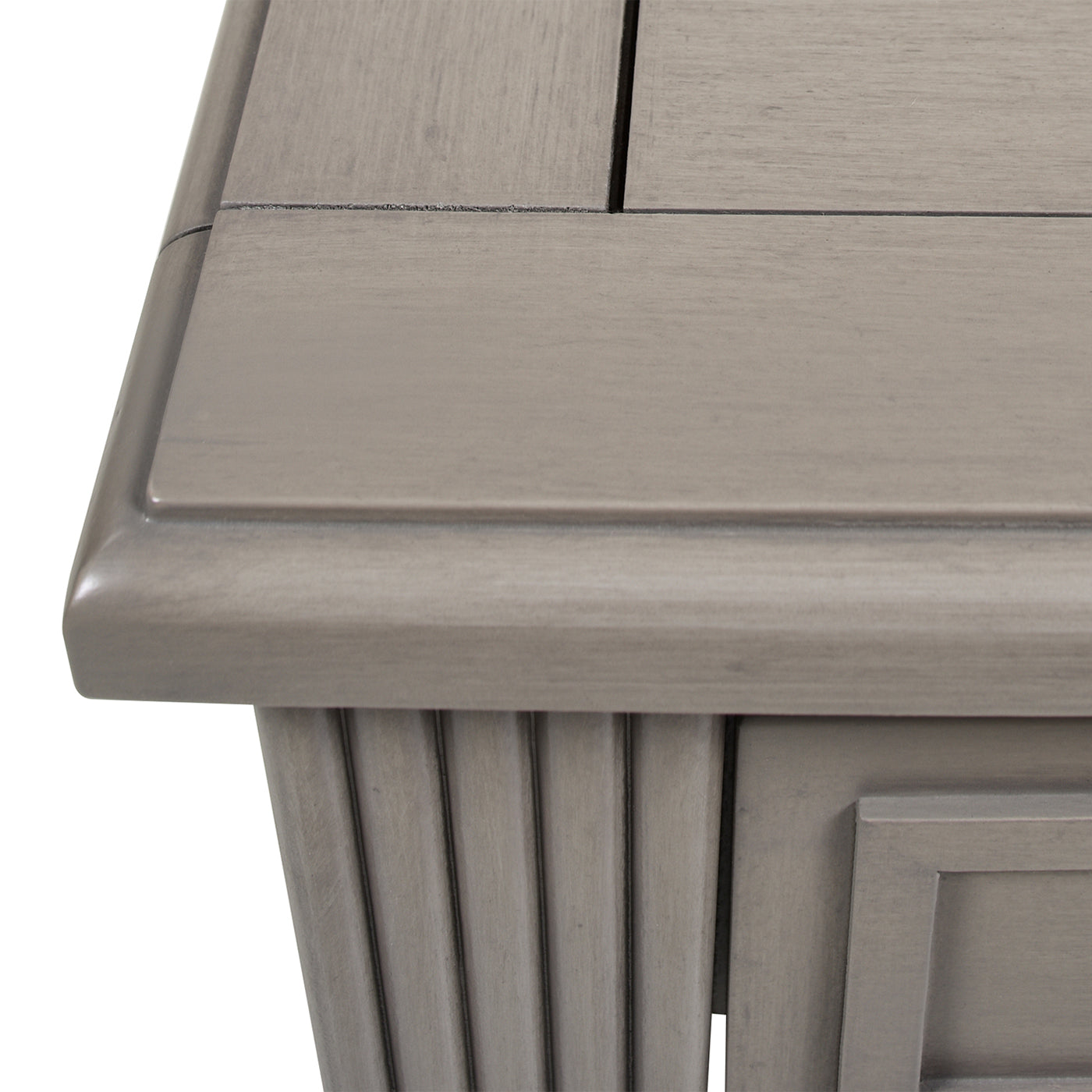 Closeup of a weathered grey wood end table top with panel detailing