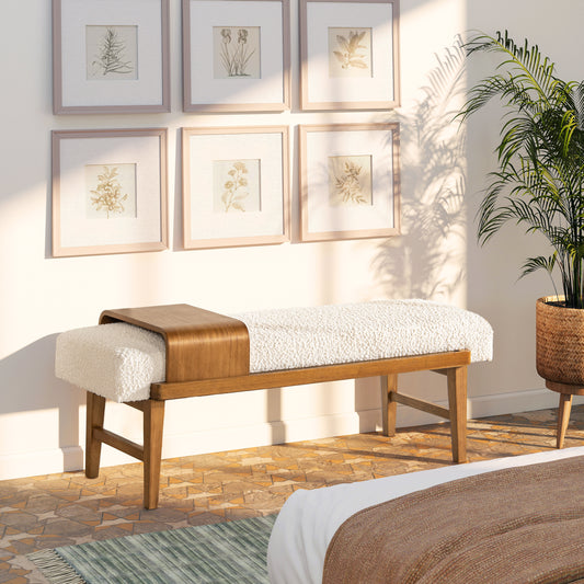 Modern boucle bench with curved wood accent ivory upholstery and dark wood legs