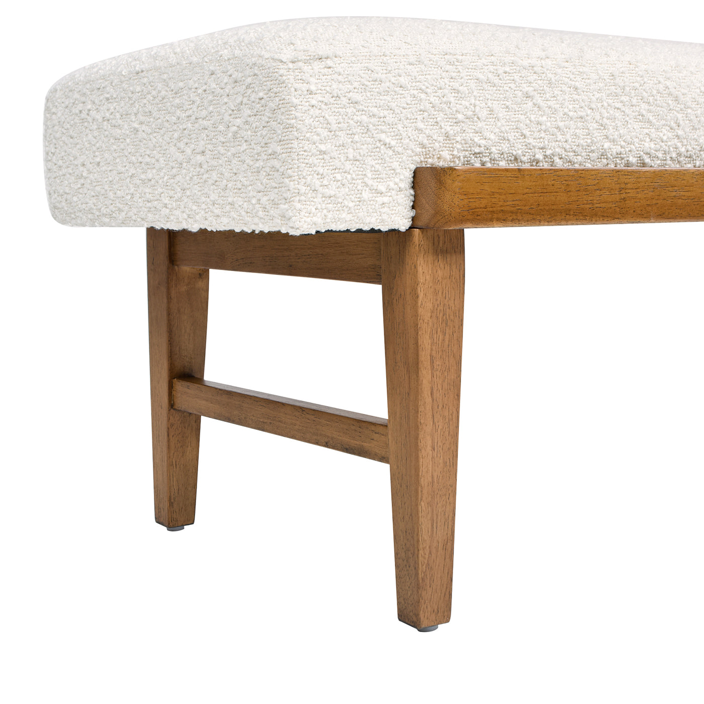 Closeup of a textured cream boucle fabric bench seat with natural wood legs