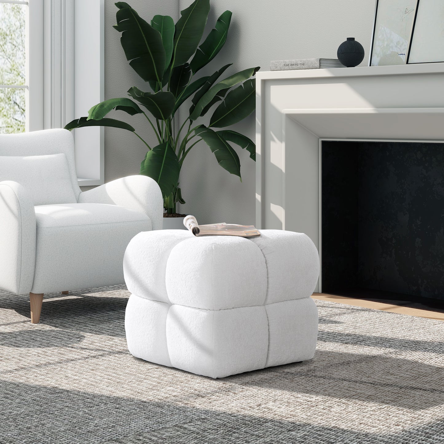 Plush white cube ottoman with channeled detailing perfect for living room seating