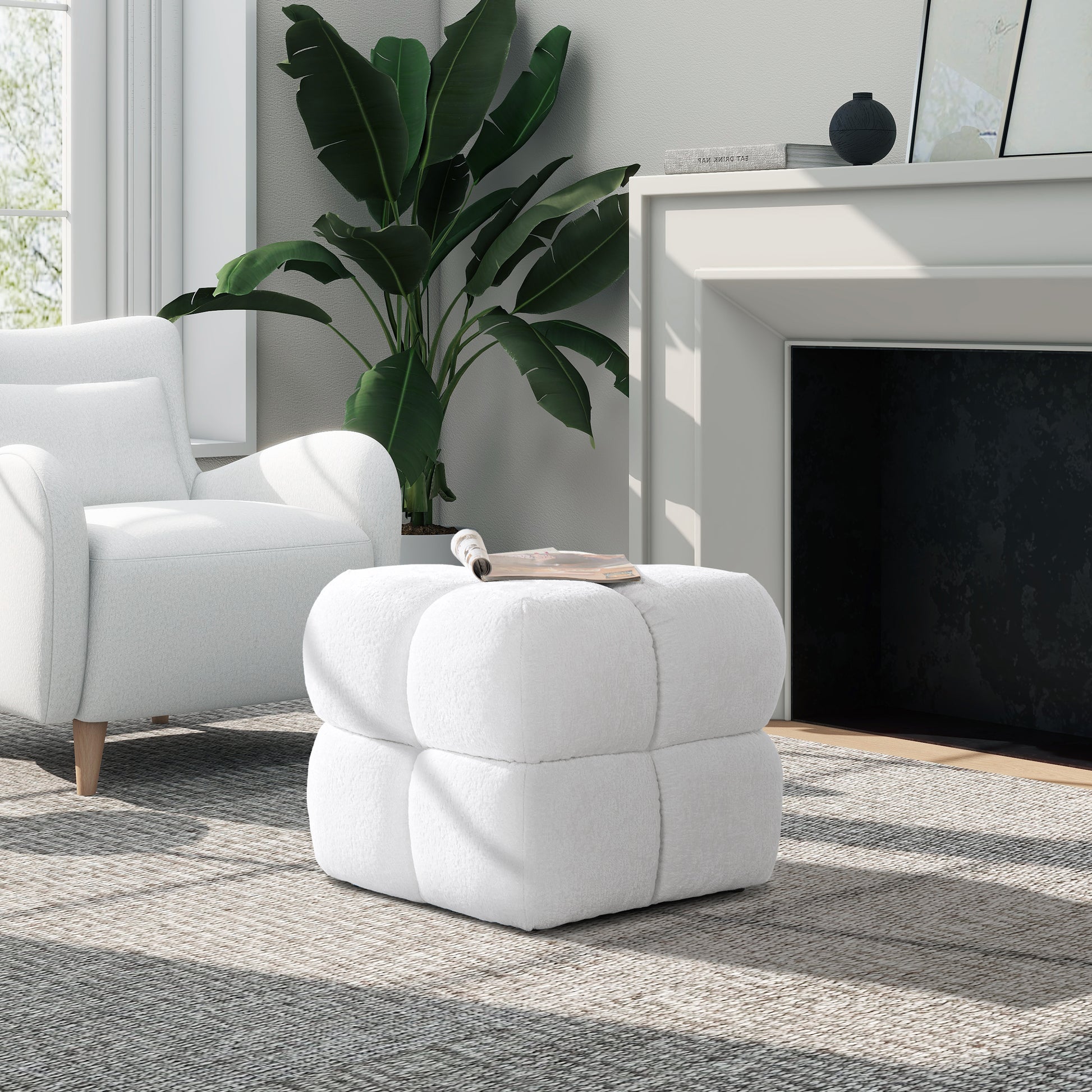 Plush white cube ottoman with channeled detailing perfect for living room seating