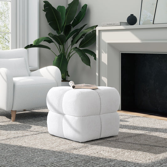 Plush white cube ottoman with channeled detailing perfect for living room seating