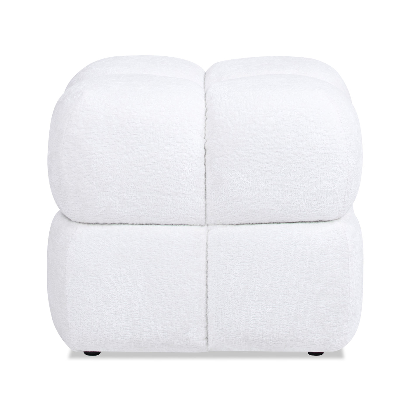 White boucle upholstered ottoman with segmented design providing a plush footrest