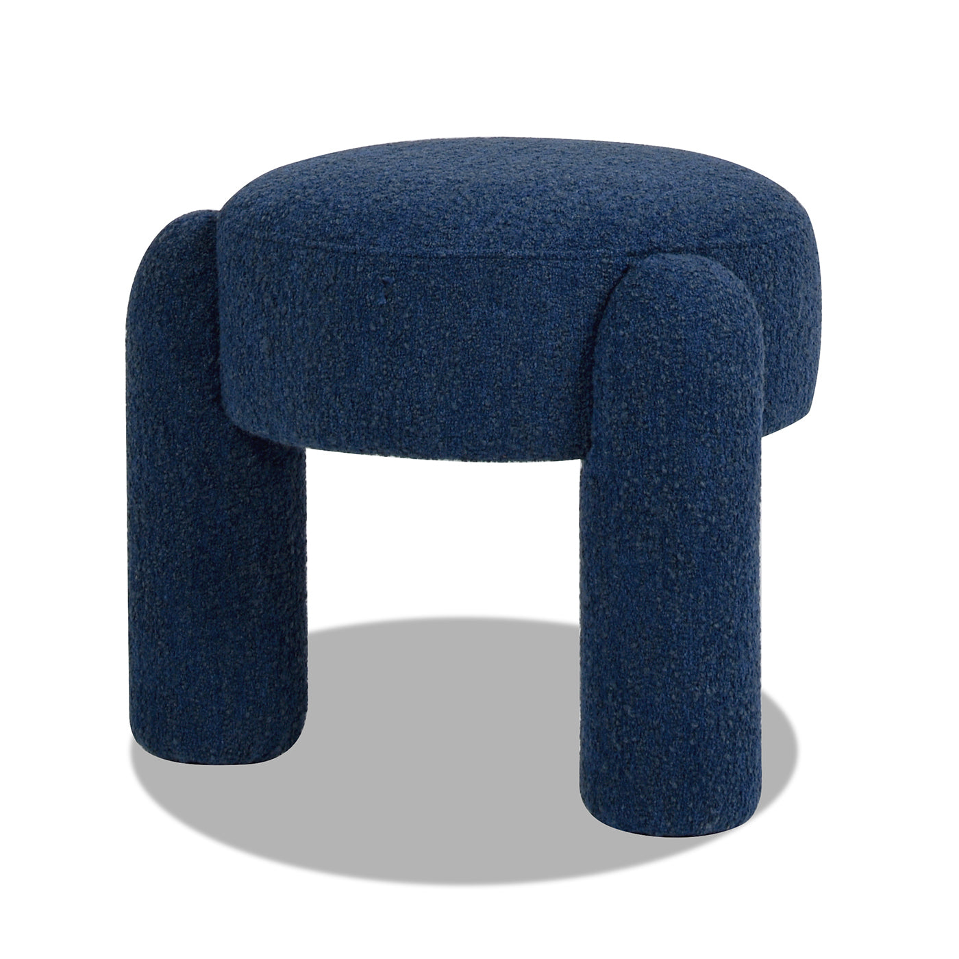 Plush navy blue boucle fabric ottoman with four cylindrical legs perfect accent for modern living rooms