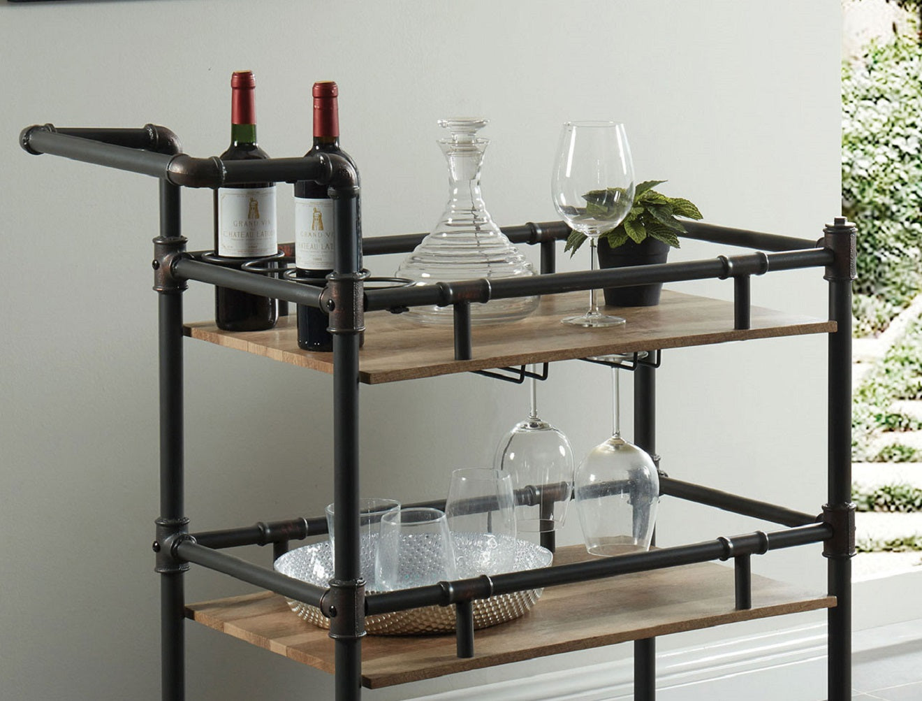 Industrial pipe bar cart with two wine bottles and decanter