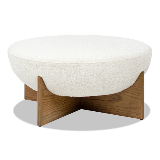 Cream boucle round ottoman with a modern wooden cross base for living room seating