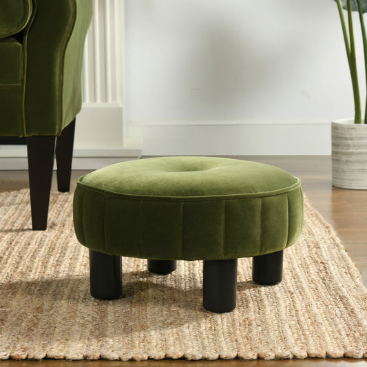 Round plush green velvet ottoman with tufted top and black legs perfect accent for any room