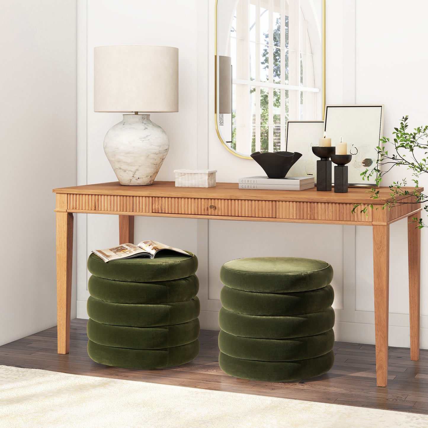 Plush velvet ottoman in deep green with a stacked round design perfect as footrest