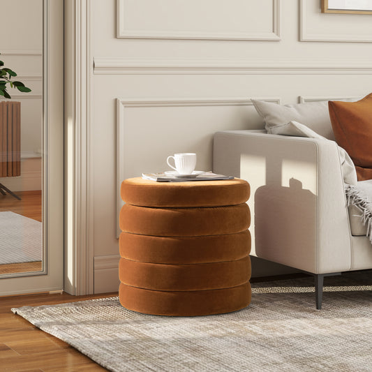 Round plush ottoman in burnt orange velvet offering versatile seating or footrest for living spaces