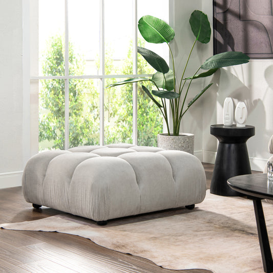 Light grey corduroy tufted ottoman with plush cushioning perfect for living room seating