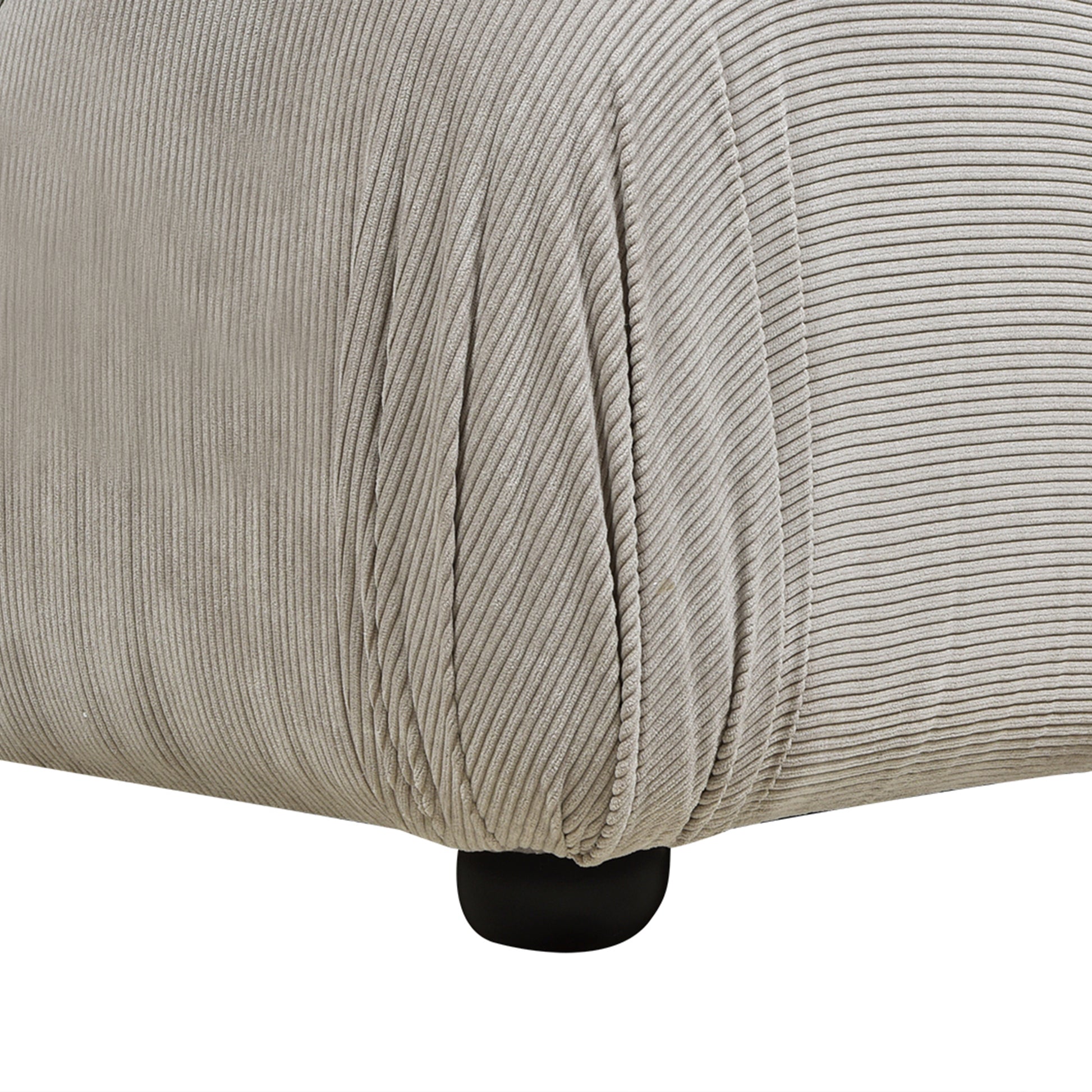 Light grey corduroy fabric texture on a rounded furniture armrest  characters
