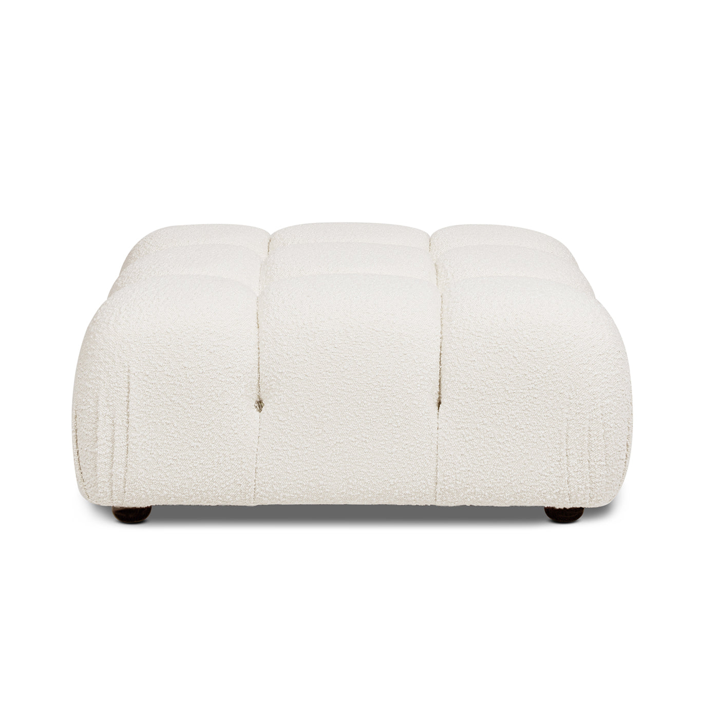 Textured cream boucle ottoman with deep tufting and dark wood feet