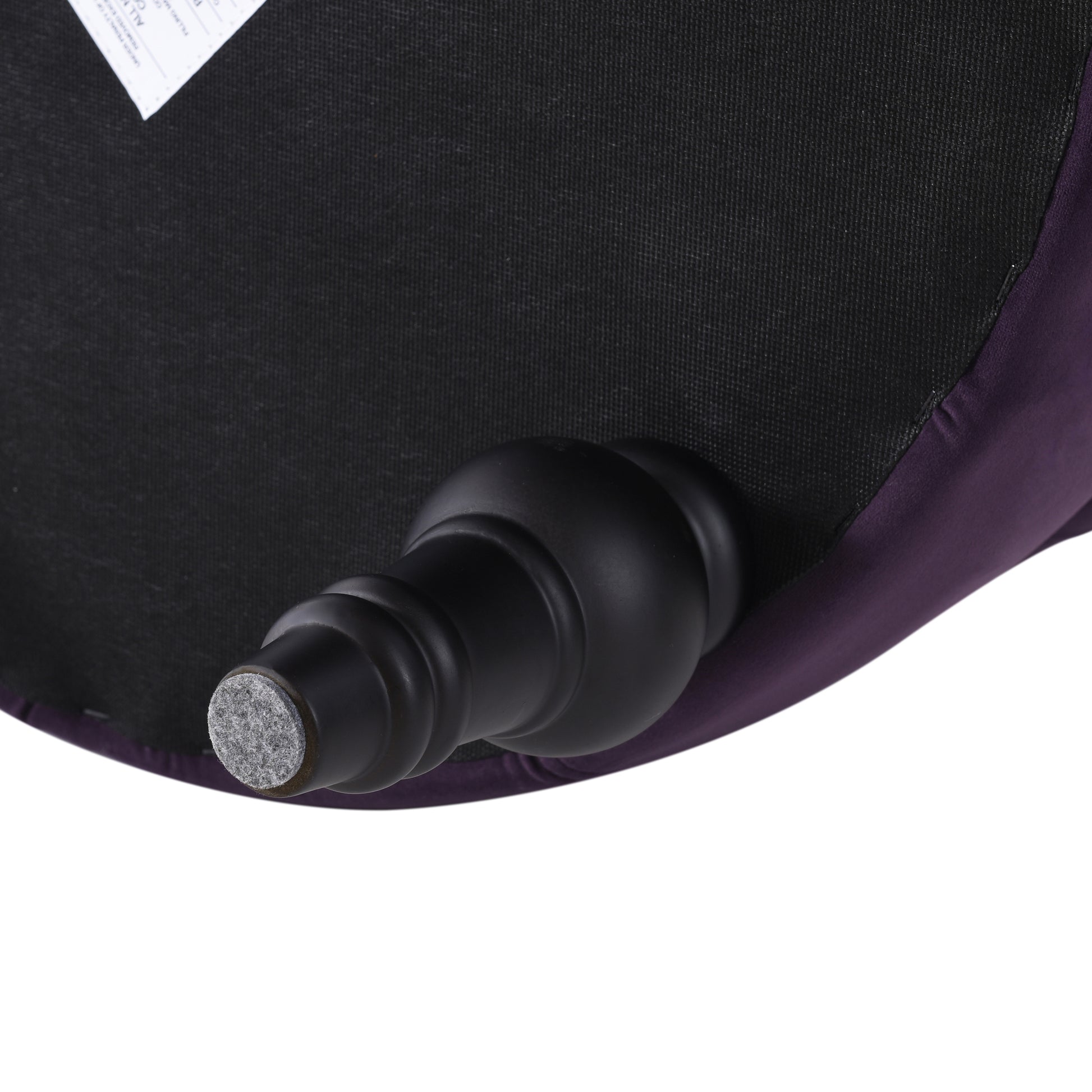 Purple velvet ottoman with black carved leg and floor protector