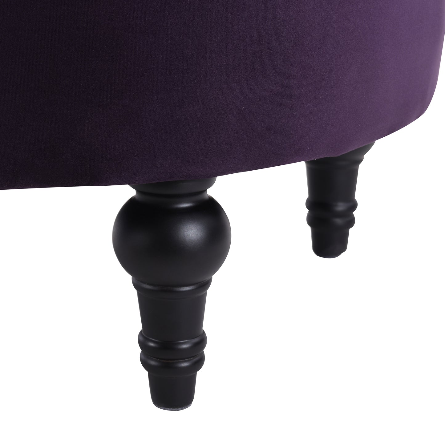 Deep purple velvet ottoman with carved black wooden legs