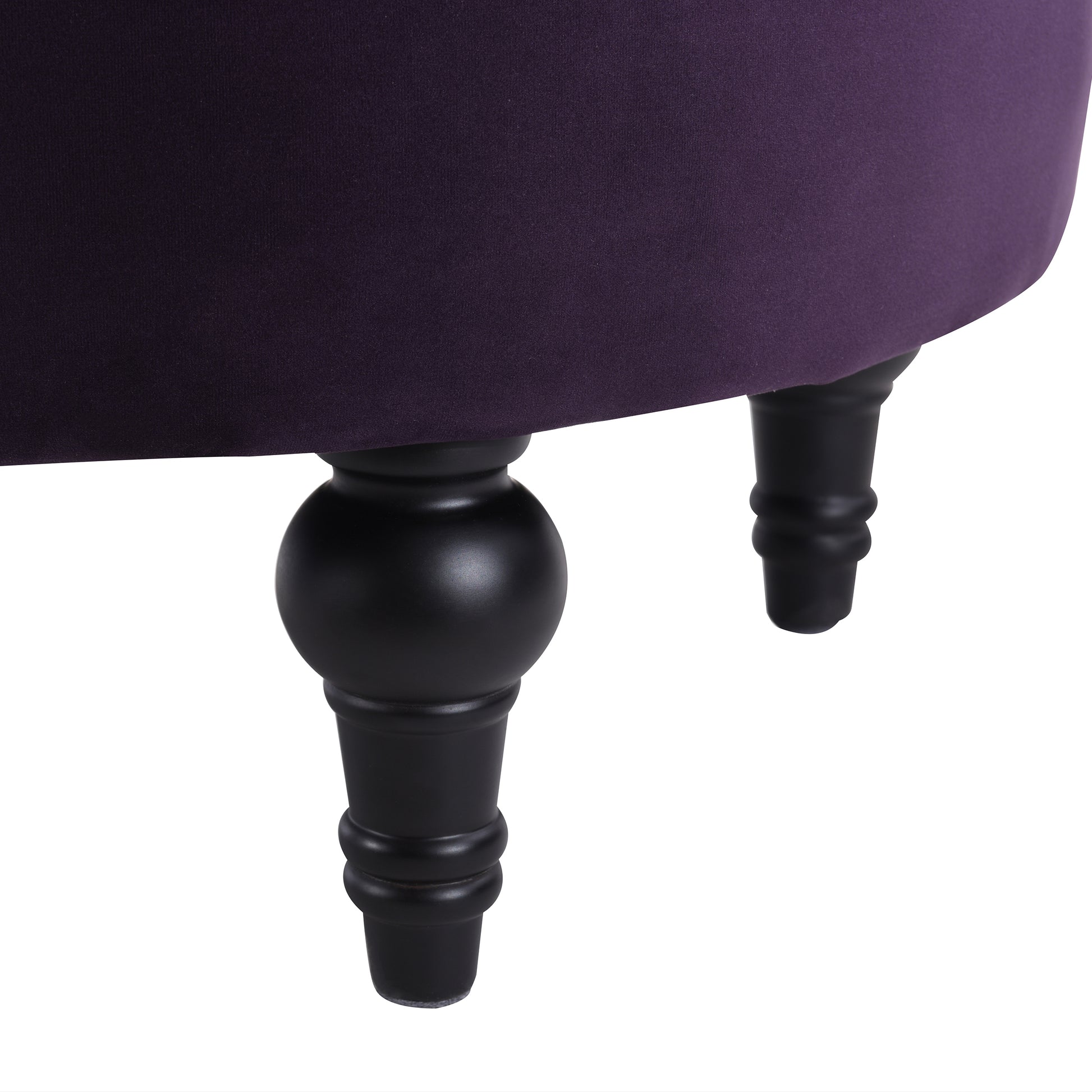 Deep purple velvet ottoman with carved black wooden legs