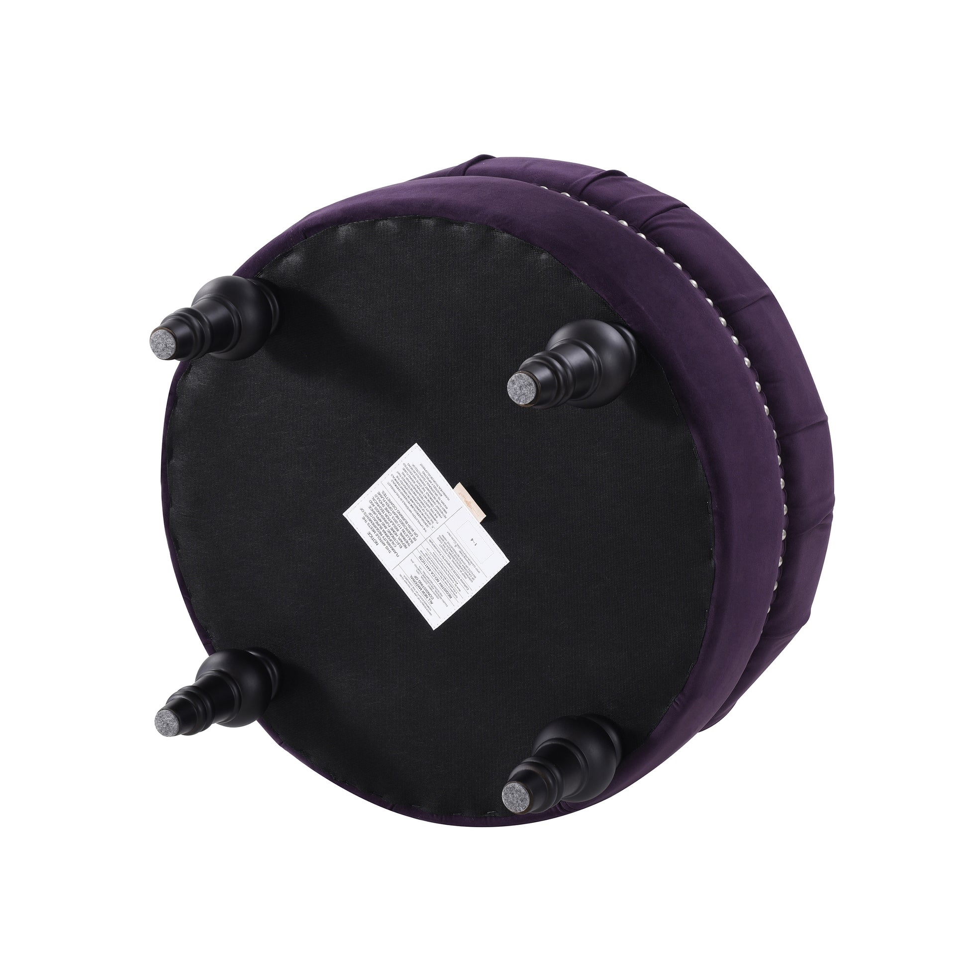 Deep purple velvet ottoman with studded trim and dark wood legs