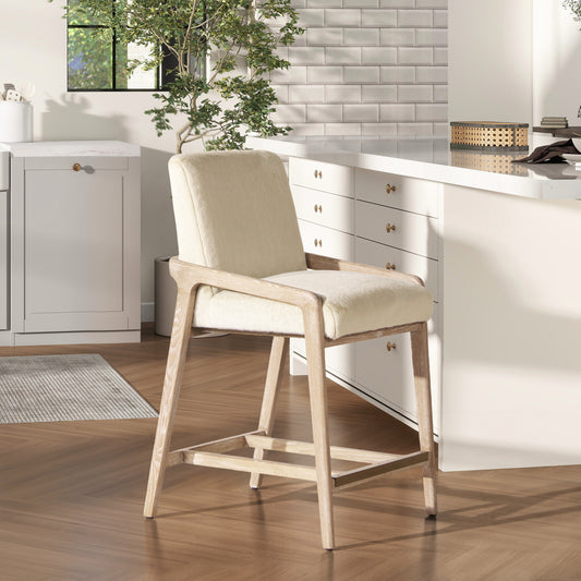 Cream boucle fabric counter stool with light wood frame perfect for a modern kitchen island