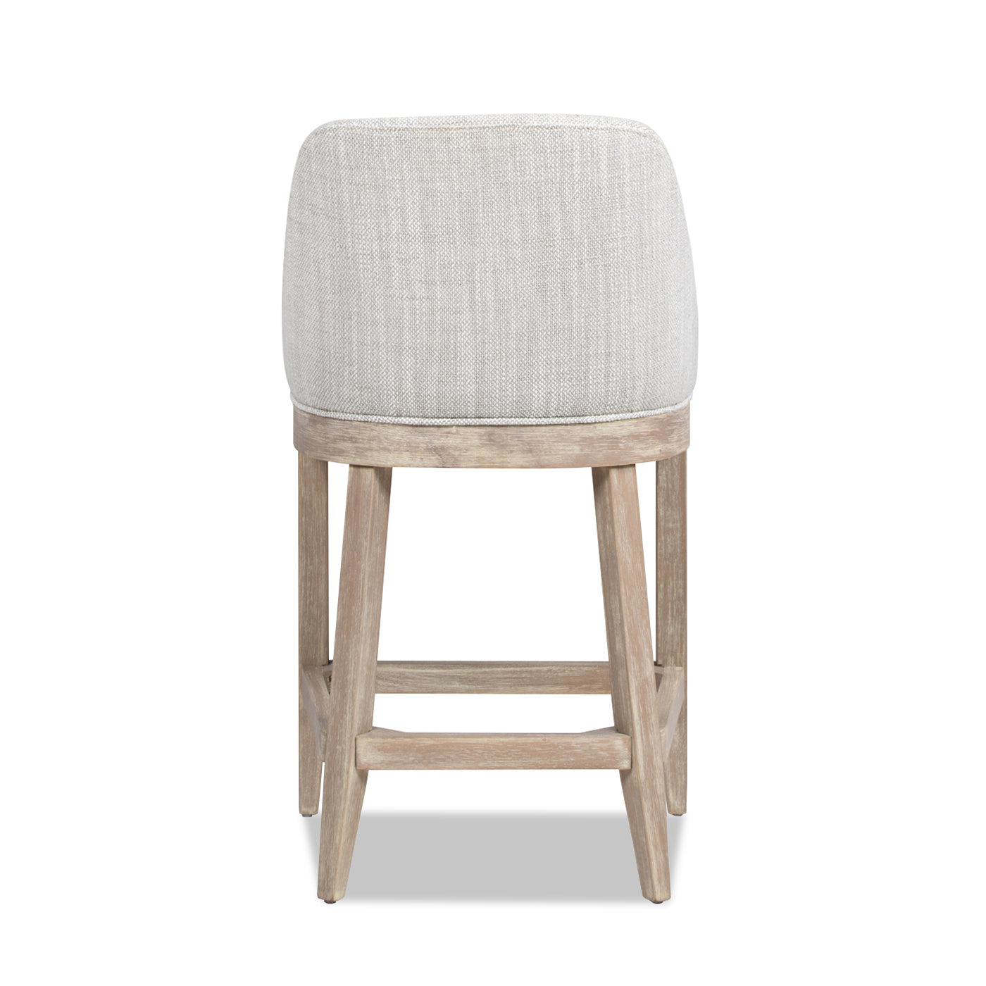 Back view of a light grey upholstered bar stool with a distressed wood frame