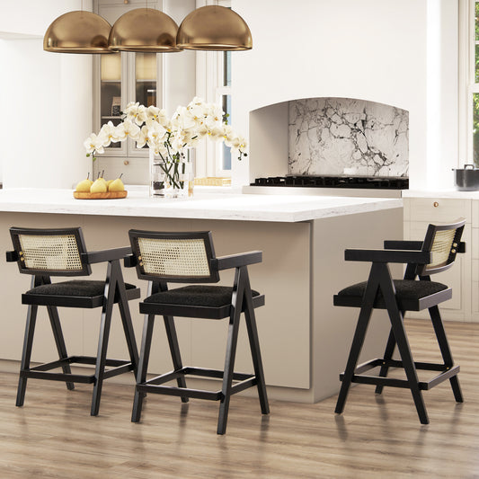 Black cane back bar stool with dark wood frame and upholstered seat