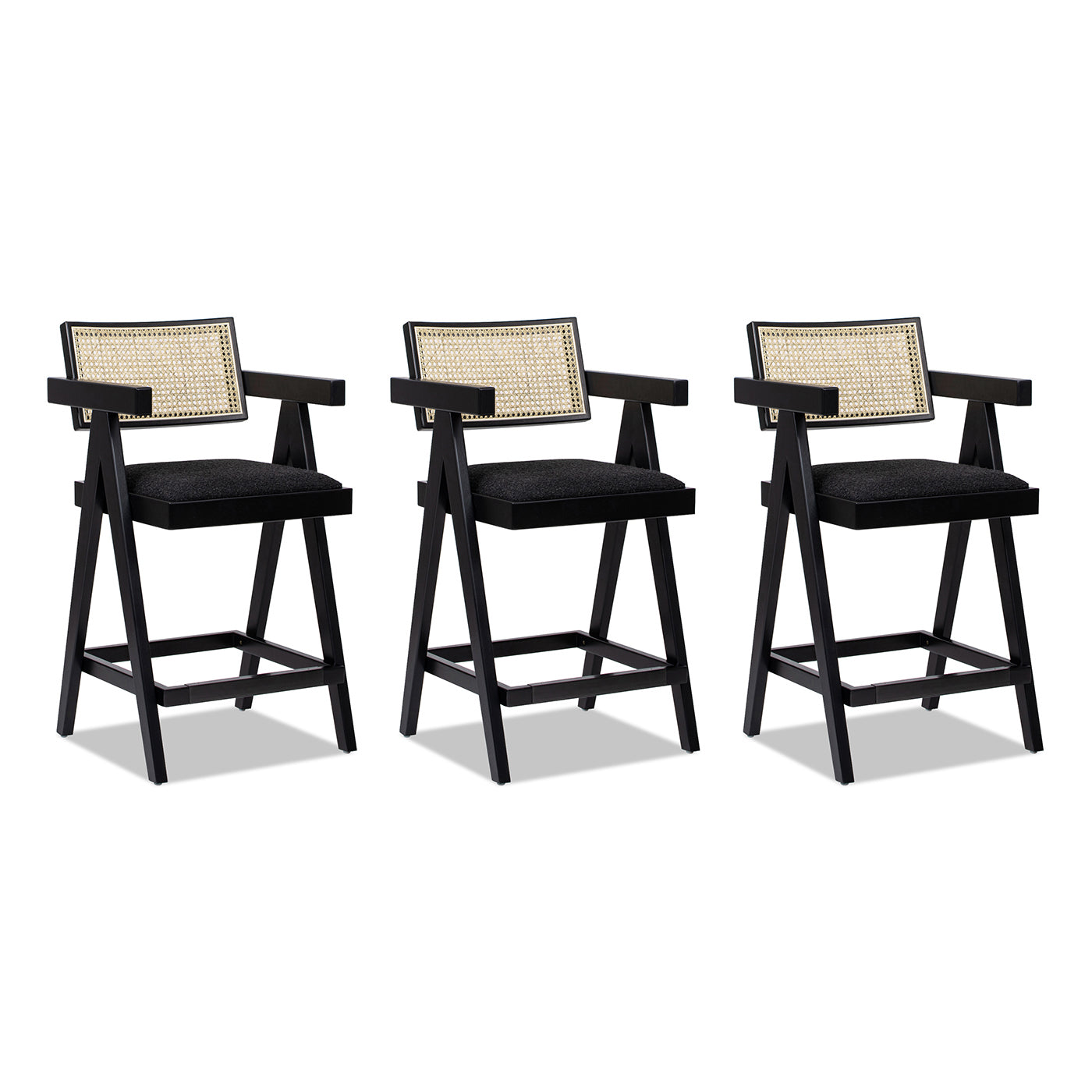 Three black cane back bar stools with upholstered seats and armrests perfect for modern kitchens