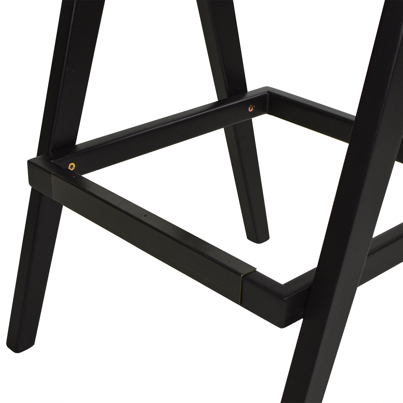 Closeup of black metal legs on a modern dining chair with visible screws