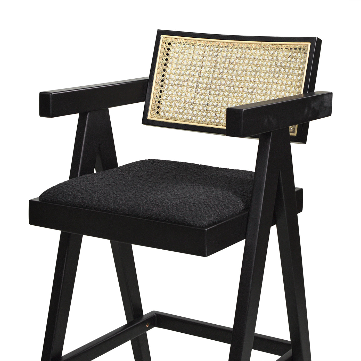 Black accent chair with cane back detail and upholstered seat