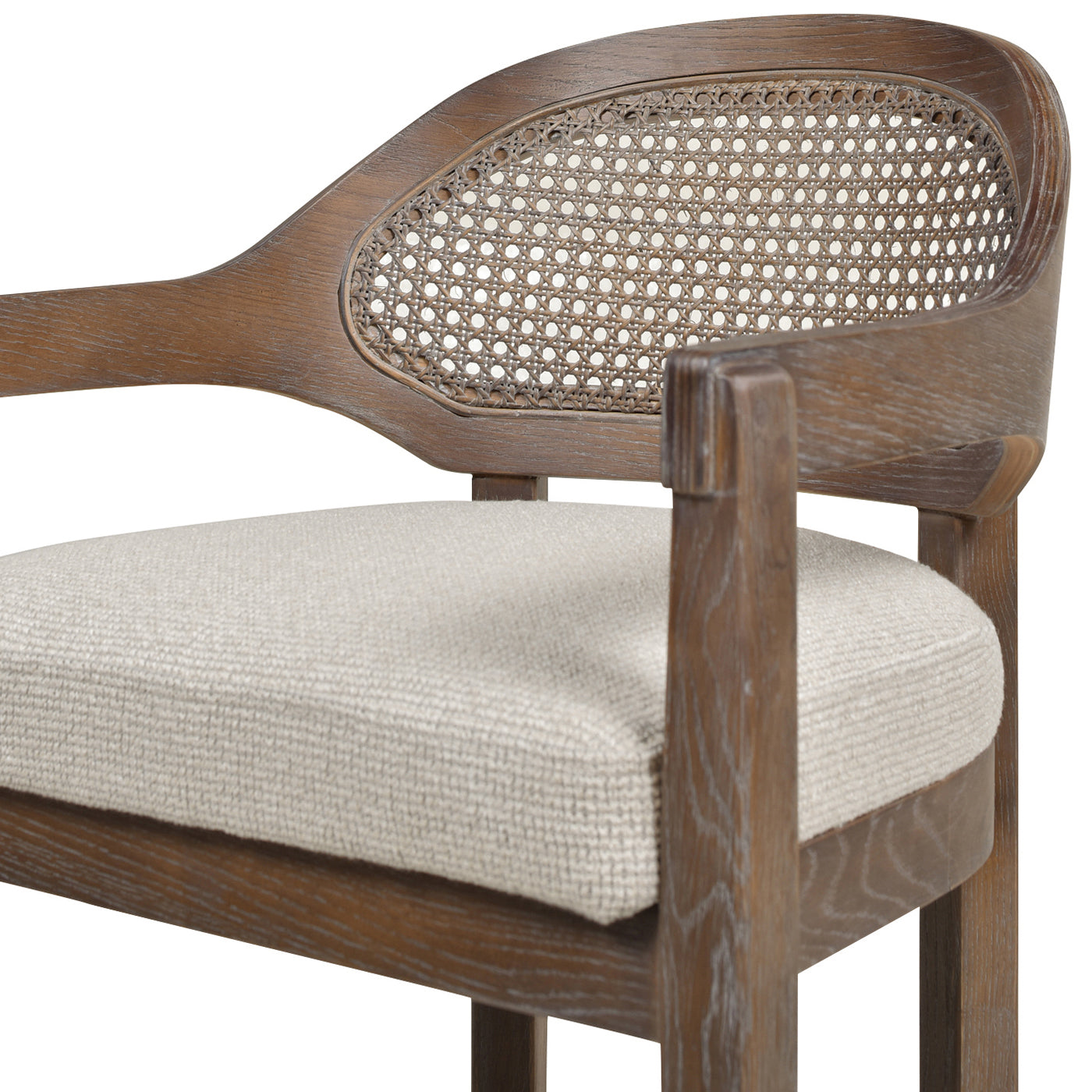 Wooden armchair with cane back and neutral upholstered seat for dining