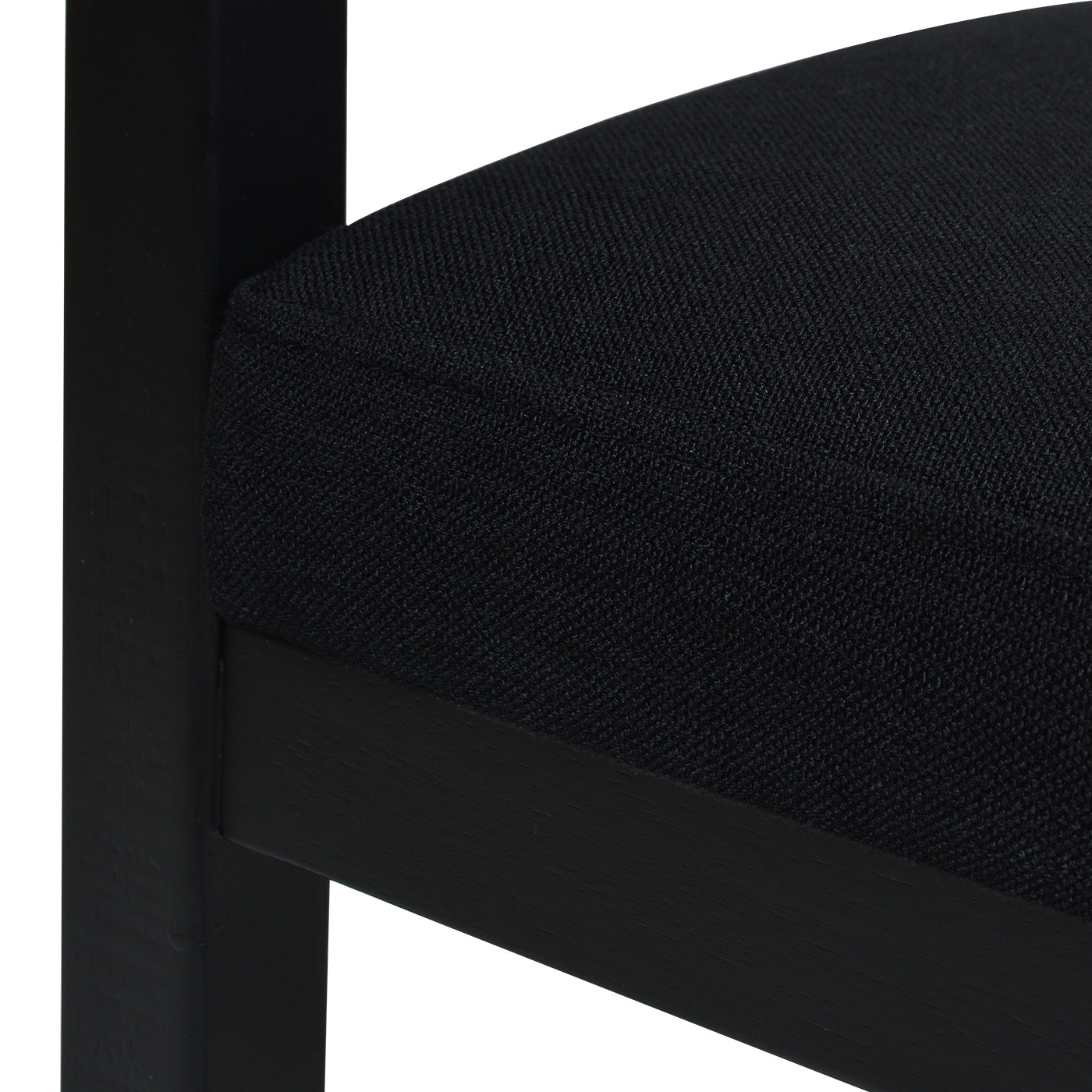 Black fabric upholstered seat on a dark wooden chair frame modern design